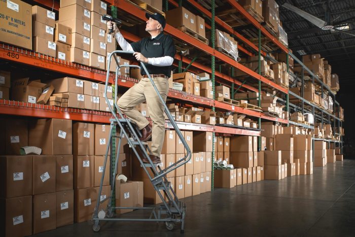 Service Partners Employees Scanning Warehouse Supplies