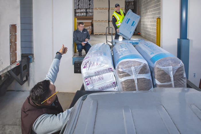 Service Partners Employees Delivering Insulation