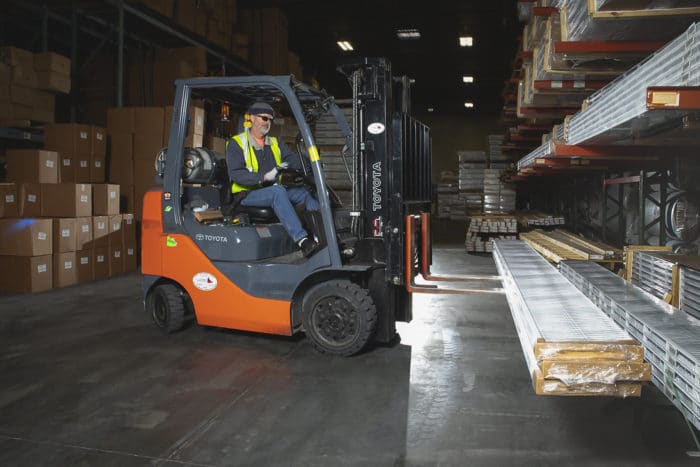 Service Partners Employee Driving Forklift