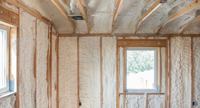 Interior of building with open cell spray foam insulation within the walls